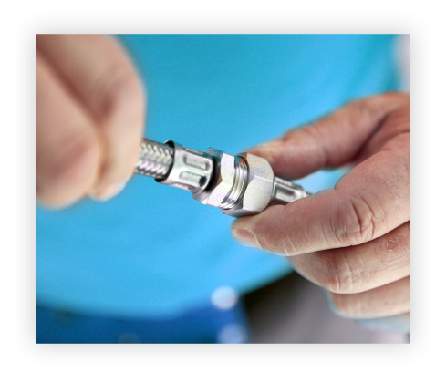 man fixing together pipes