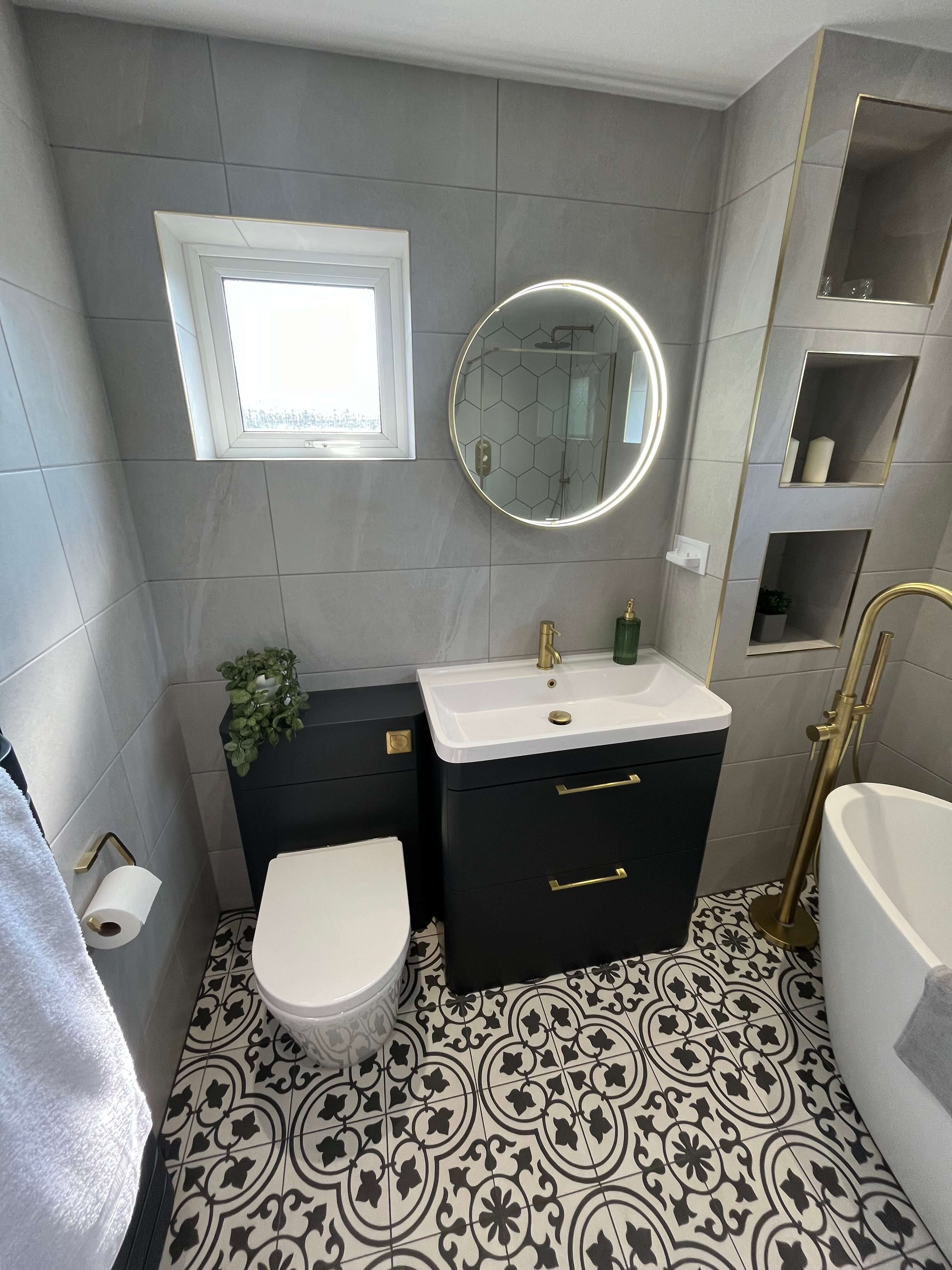 bathroom renovation showcasing toilet, sink and storage